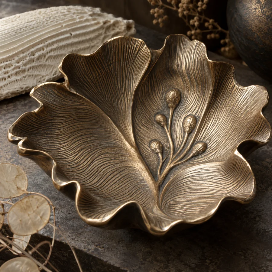Cuttlefish-Bone Casting: Cast metal preserving fine rippling cuttlefish-bone grain, organic striations and softly carved relief.